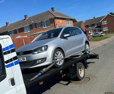 alt="End-of-life vehicle being removed in Worcester city centre"