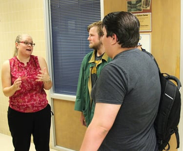 Dr. Hooton, left, discussing Mexican American history with two students (right) at Angelo State.