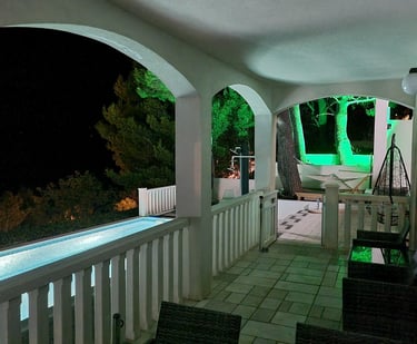 Courtyard and pool at night with green garden lighting, Easy Living, Lokva Rogoznica