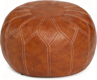 Round brown faux leather Moroccan pouf ottoman with decorative white stitching for home decor.