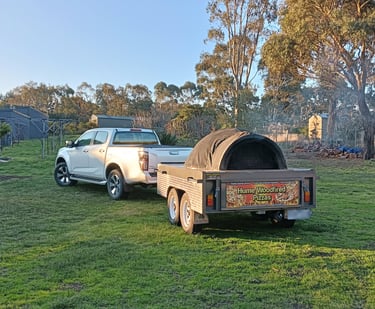 car with an oven pizza trailer
