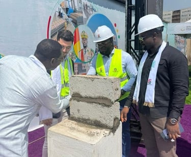 a group of men standing around a cement block