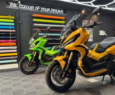Honda ADV scooters wrapped in green and yellow gloss vinyl finish