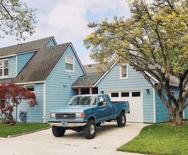 Truck parked on a newly finished concrete driveway installed by Custom Concrete Texas.