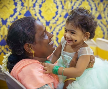 a woman holding a baby in her arms