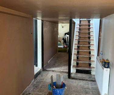 Smooth plasterwork on a residential wall by Franklins Plastering