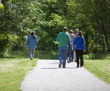 Photo of people walking on a gravel trail