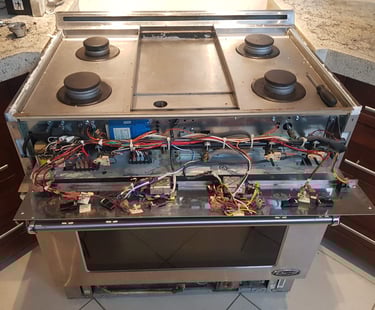 Gas stove burner control panel is open for the diagnostic