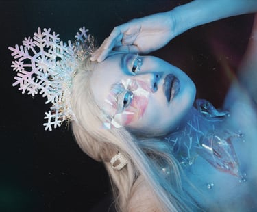 An icy makeup look where my skin is painted white, decorations everywhere.