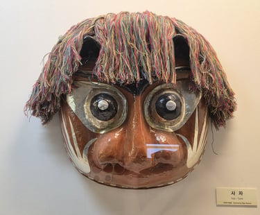 Bukcheong Saja Noreum lion mask on display at the Hahoe World Mask Museum