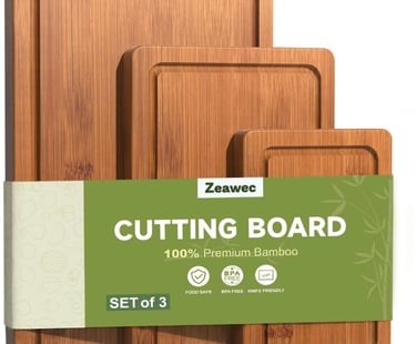 Set of 3 premium bamboo cutting boards with juice grooves for kitchen food preparation.