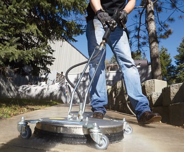 person clean with pressure washing