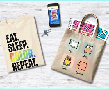 cream tee with phrase "EAT.SLEEP.COLOR.REPEAT." and tote bag with icons representing each of those