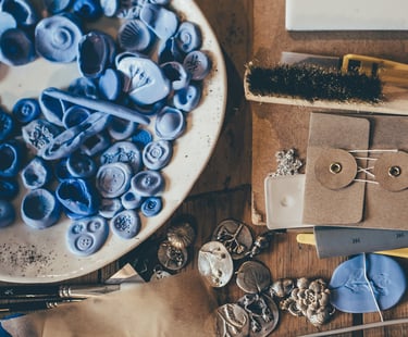 Work desk with random pieces of clay in a bowl