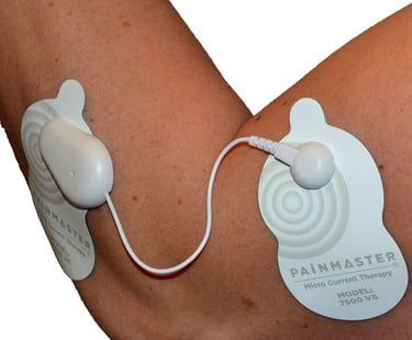 Painmaster patches attached to an elbow.