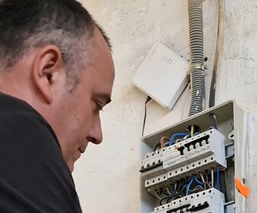 a man in a green shirt is holding a piece of wood