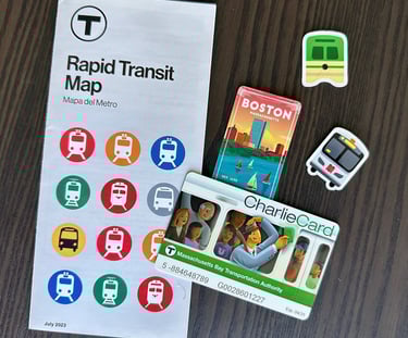 a mbta rapid transit map, Charlie card, and various transit themed stickers