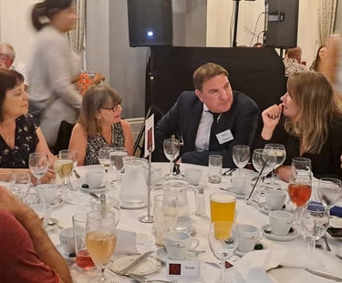 an actor in character being grilled by guests