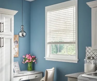 home office nook with white wood blinds and blue accent wall – Rise Up Window Coverings Milwaukee