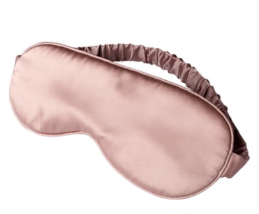 Silk sleep mask with elastic strap shown on white