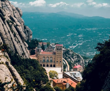 Panoramic view of the Montserrat Monastery perched on rugged mountain cliffs