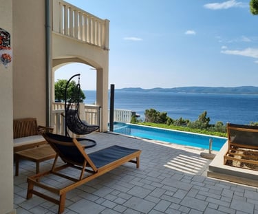 Hanging chair and wooden dining set with pool and sea view, Lokva Rogoznica