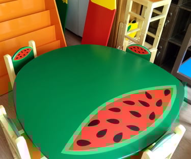 Kids watermelon themed round green table and chair set for a colorful classroom or playroom.