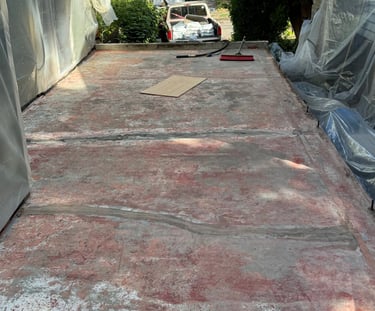 1930's Concrete paint and sealer that has chipped and failed to hold water out of the garage below.