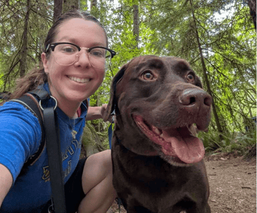 dog walker with a happy dog in Squaxin Park, Olympia WA
