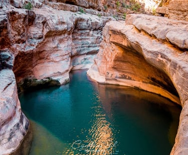 a river flowing through a canyon in the middle of a canyon