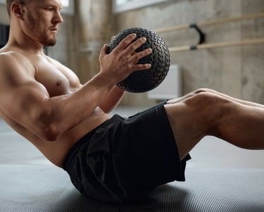 a man using a medicine ball for exercise