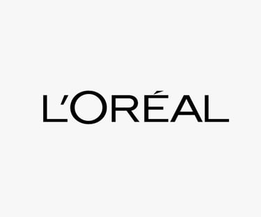 Logo of L'ORÉAL, a global beauty brand whose standards are met by King Fly.