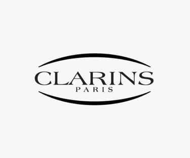 Logo of CLARINS, a global beauty brand whose standards are met by King Fly.