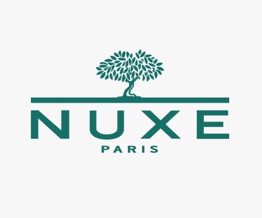 Logo of NUXE, a global beauty brand whose standards are met by King Fly.