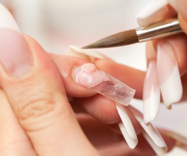 nail salon customer getting acrylic nail services