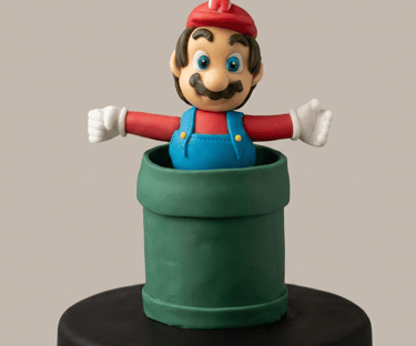 Figura inspirada en Mario Bros modelada artesanalmente en fondant por Cocina con Ely, elaborada para
