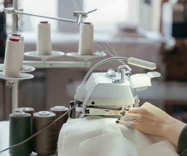 Behind the scenes with Ellen, master seamstress, altering and restoring clothes in her workshop.