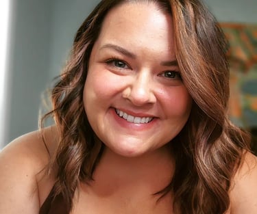 Caucasian woman smiling at camera; brown hair