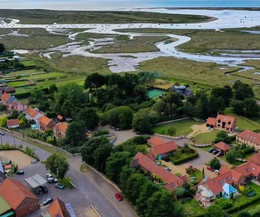 Brancaster Staithe village and marsh airial view