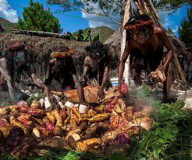 cooking method uses a pit in the ground combined with heated stones