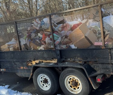 Old stove being removed from kitchen during renovation cleanout