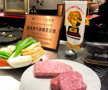 a table with a plate of raw wagyu meat