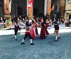 Local youth performing the "Trescone," a traditional Tuscan folk dance during town festivals.