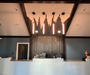 a picture of commercial construction showing a reception desk with a large wooden reception table