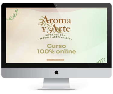 A computer screen displays the "Aroma y Arte" logo, emphasizing a 100% online course for handmade soap making.