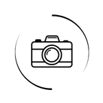 Minimalist black and white line art icon of a digital camera inside a circular border.