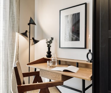 Working area with wood desk and subtle lighting, cozy decor and natural colour palette