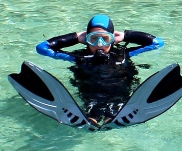 a person in a wetsuit and a scuba suit