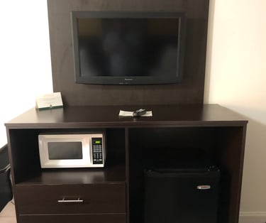 a microwave and a refrigerator in a room