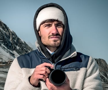a man in a white jacket and a camera